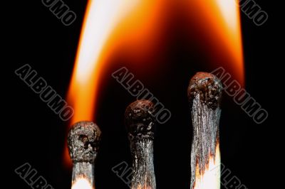 Match with smoke isolated in dark background