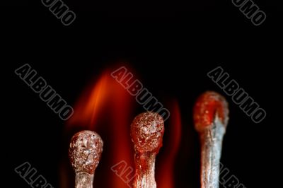 Match with smoke isolated in dark background