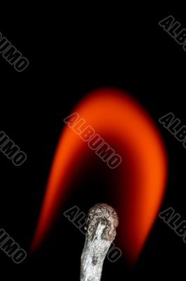 Match with smoke isolated in dark background