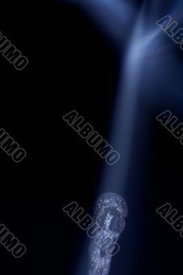 Match with smoke isolated in dark background