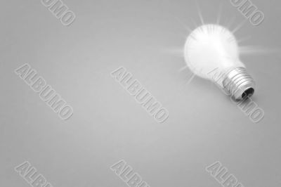 Background with lit lightbulb