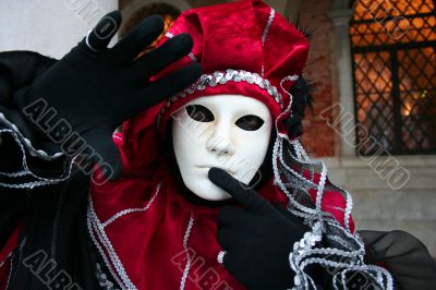 Man`s mask in a red suit.