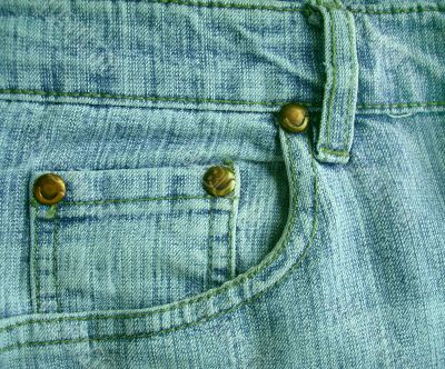 Background a jeans pocket with metal buttons