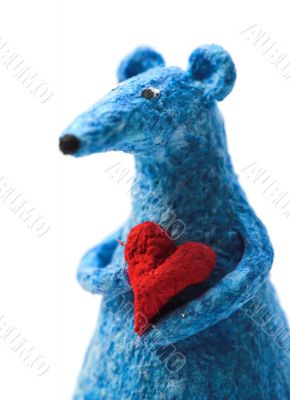blue toy rat holding a heart in arms