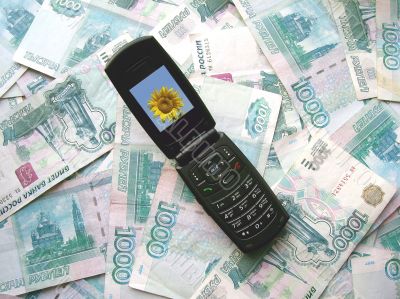 Mobile phone laying on banknotes of Russia