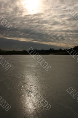 Patches of light of the sun on an ice and the sky.