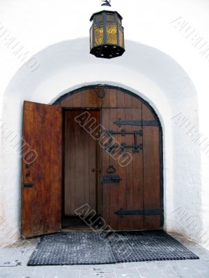 Door in ancient Russian style. Lantern