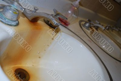 Dripping water in a dirty sink