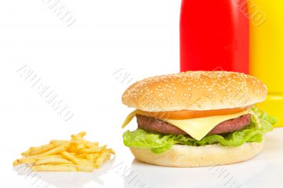 Cheeseburger, mustard, ketchup and french fries