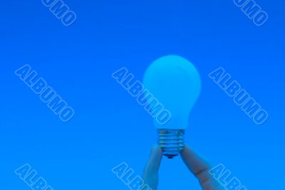 Background with lit lightbulb