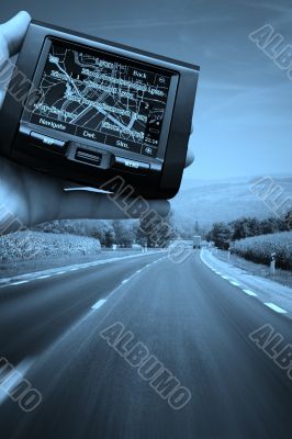 GPS Vehicle navigation system in a man hand.