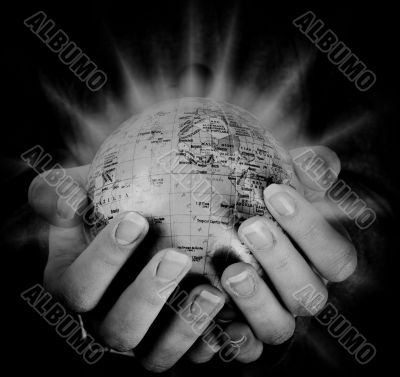 Globe in a girl`s hands