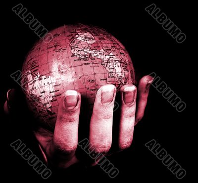 Globe in a girl`s hands