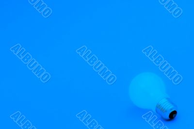 Background with lit lightbulb