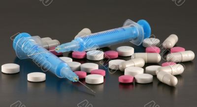Tablets, pills and syringes