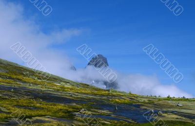 Rock is in fluffy clouds. Rock is in fluffy clouds.