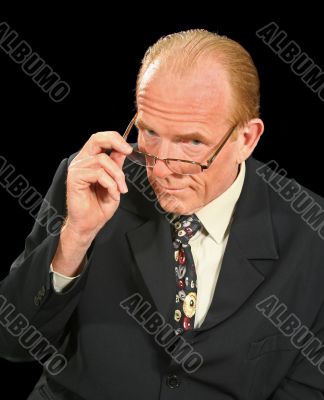 Businessman Looking Over Glasses