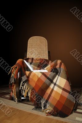 Rocking-chair and book