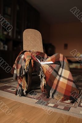 Rocking-chair and plaid
