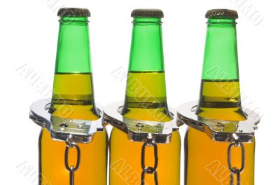 Beer and Handcuffs - Drunk Driving Concept