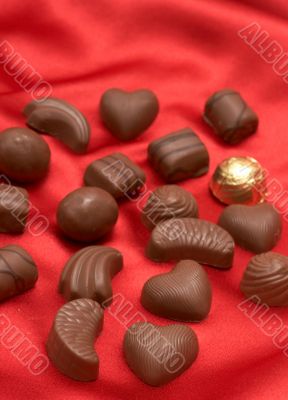 Valentines chocolates on red silk