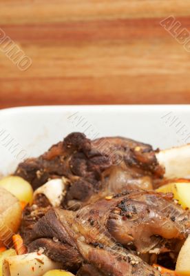 Lamb shanks cooked with potatoes
