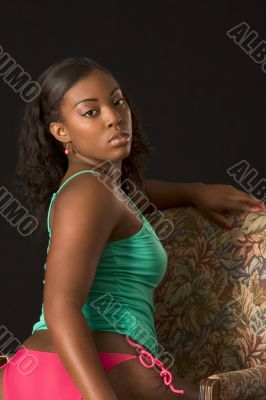 Glamorous African-American girl in chair