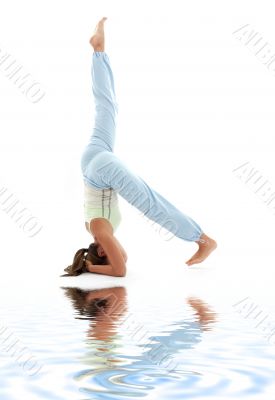 supported headstand on white sand 3