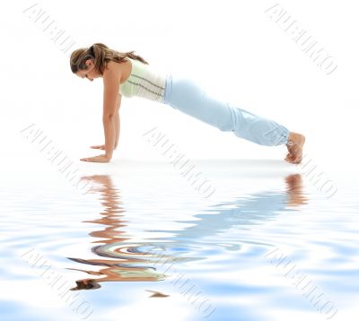 four-limbed staff pose on white sand