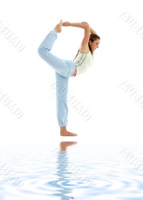 lord of the dance pose on white sand