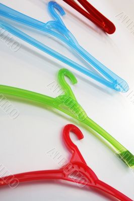 Colored coat hangers.