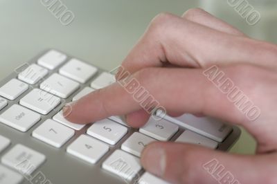Hand on Keypad