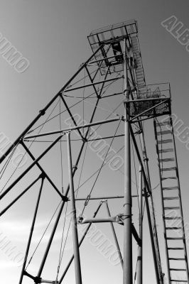 The thrown old rusty oil derrick