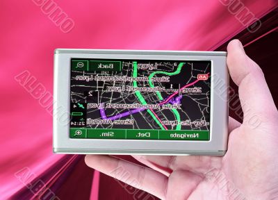 GPS Vehicle navigation system in a man hand.