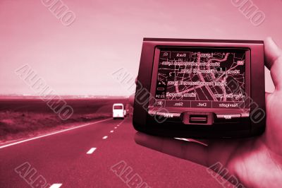 GPS Vehicle navigation system in a man hand.