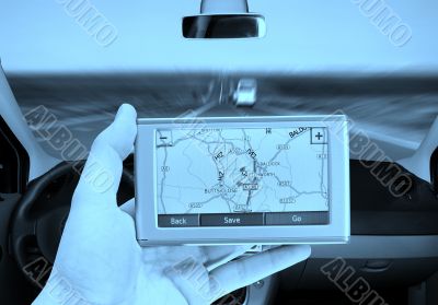 GPS Vehicle navigation system in a man hand.