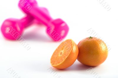 pink dumbbells orange in focus