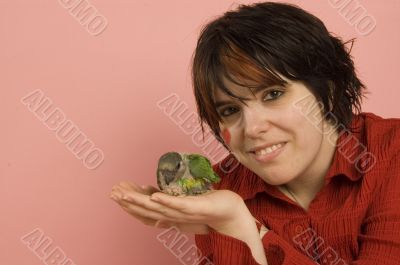 beautiful woman holding baby parrot beautiful woman holding baby parrot