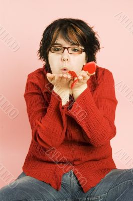 young beautiful woman blowing hearts away young beautiful woman blowing hearts away