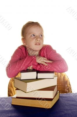 young little girl above a stock of books young little girl above a stock of books