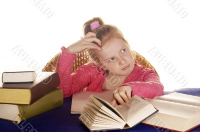 young little girl thinking over her study