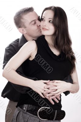 Man is kissing his girlfriend