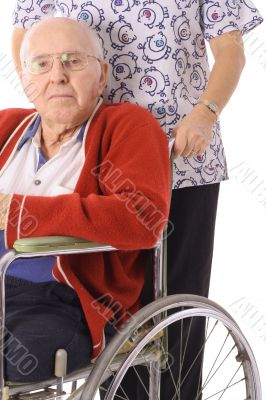 handsome elderly man in wheelchair with nurse