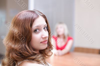 Woman discuss your secret in office