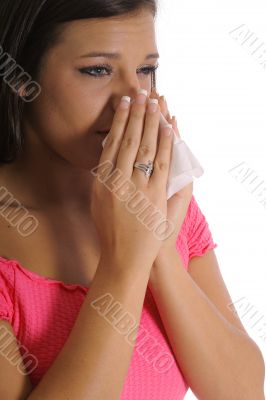 beautiful girl with allergies sneezing