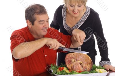 couple slicing ham