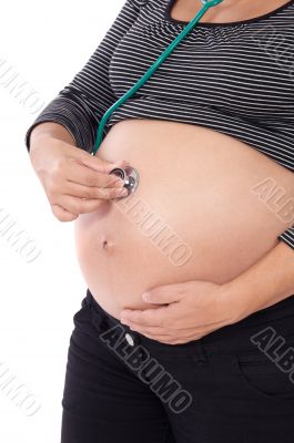 Woman pregnant with stethoscope