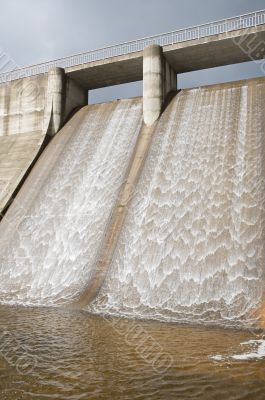 Dam water to generate energy