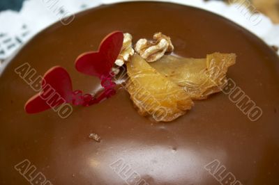 Glazed chocolate cake with two red lovely hearts Glazed chocolate cake with two red lovely hearts