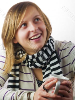 Girl drinking coffee and smiling